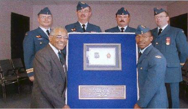 Holding the plaque: Dr Lorne White and Pte Nolan Reddick from 144 AEF, whose great-uncle served with No 2 Construction Battalion. Looking on: Maj Carlos Marques, CO 14 AES, LCol Brian Neyedli Fmn CE Offr CFB Halifax, CWO Bill Bolch 144 AEF WO and Capt Brian Boss OC 144 AEF.