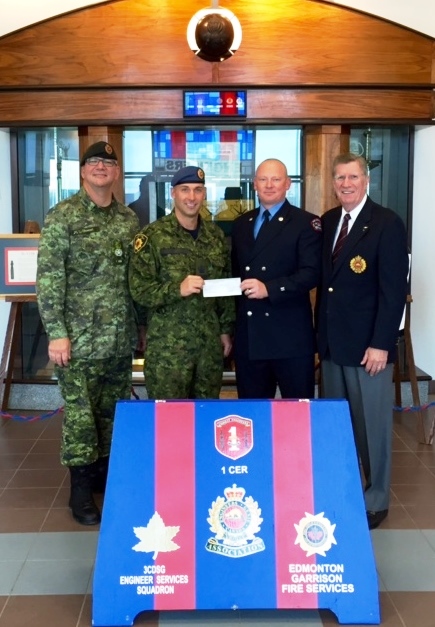 CMEA Edmonton Chapter presents a cheque to the Firefighters Burn Treatment Society 