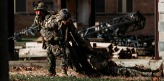 Spr Noah Burry (2 CER) and Lance Cpl Alex Roley (US Marines 2 CEB) relocate a simulated casualty during the final training event of Exercise Bold Quest 21.2 at Muscatatuck Urban Training Center, Ind., Nov. 16, 2021.