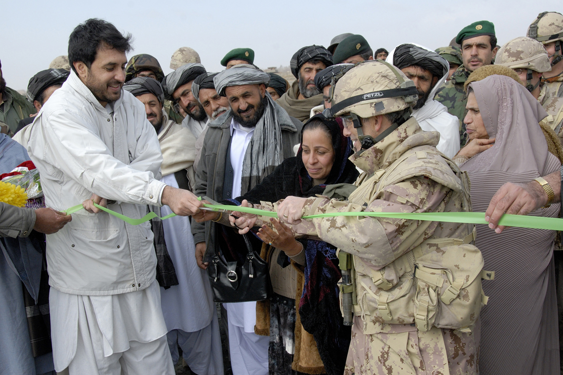 The Commander of Joint Task Force Afghanistan, Brig. Gen. Guy Laroche, cuts a ribbon representing the inauguration of the Arghandab Causeway in company of the Governor of Kandahar Province, Assad Ullah Khalid and Zarghuna Kakar, Provincial Council member. (Photo credit: DND 2008)
