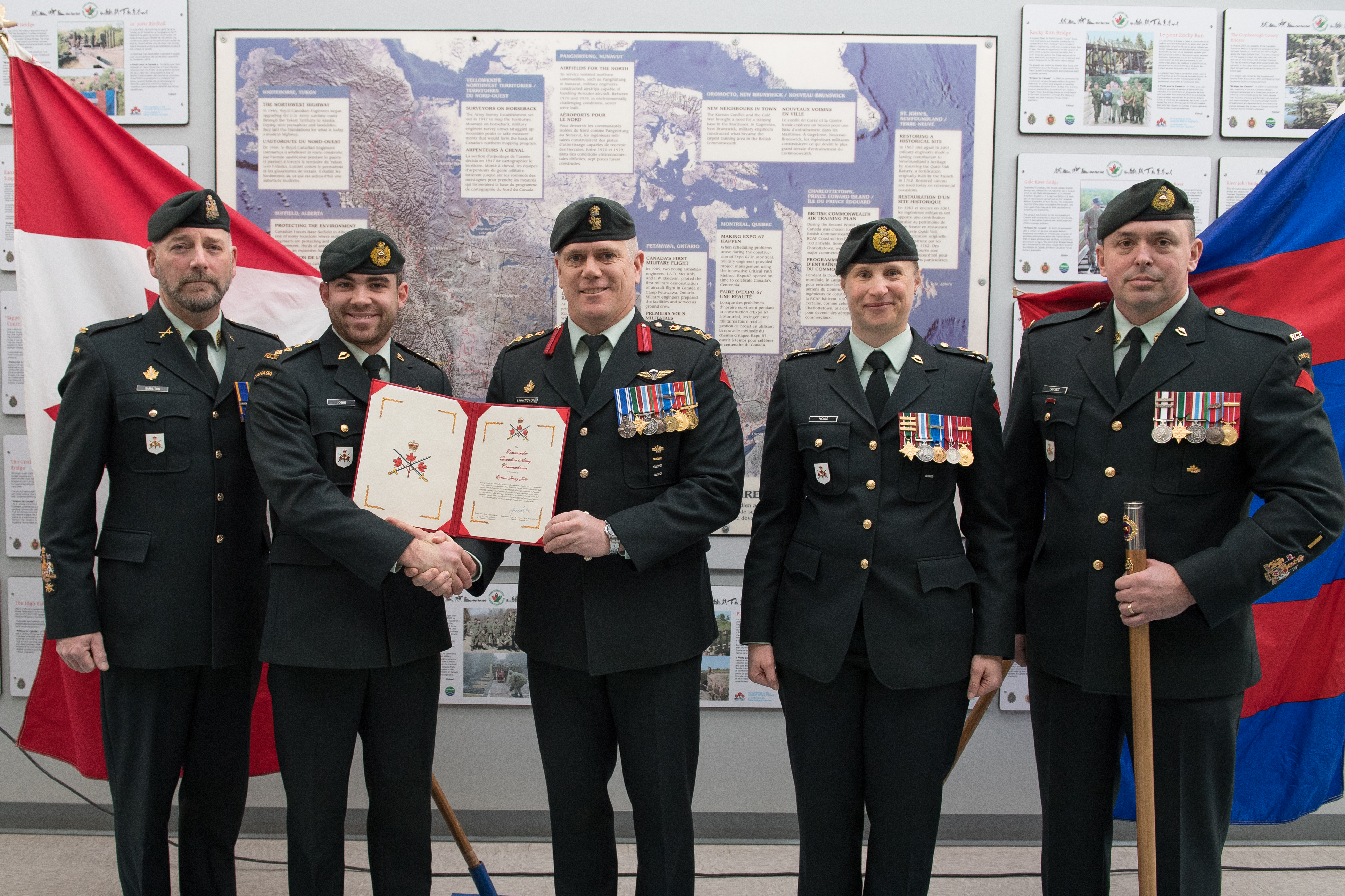 Capt Jobin receives Army Commander's . [CWO Hamilton (Formation CWO), Capt Jobin, Col Errington (Comd CTC), LCol Honig (Cmdt CFSME), CWO Lapointe (SCWO)]