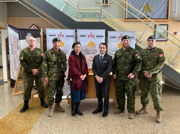 (L-R): RPOU(W) RSM, CWO Eric Barney; RPOU(W) CO, LCol John Hallet; DMA, Natasha Kim, Senior Advisor to the DM, Jayson Derow, Edmonton RPO Det OC, Maj Mackenzie Smith and Edmonton RPO Det Sergeant Major, MWO James Richardson. Photo by: Capt Kyle Ho