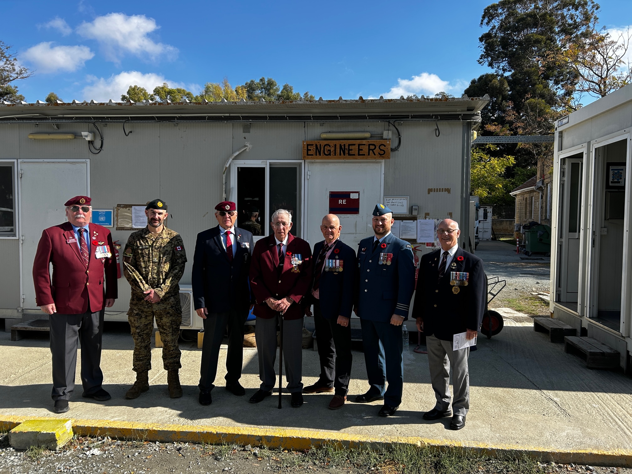 Posing in front of Britcon Royal Engineer Office at Wolseley Barracks joined by Engineer Major Sawatski, serving with the Lebanon Task Force, and Engineer LCol Marc Comeau, who on the request of his father, Real who was with 1 Cdo throughout the ‘74 action, was instrumental in initiating and organizing the tour.