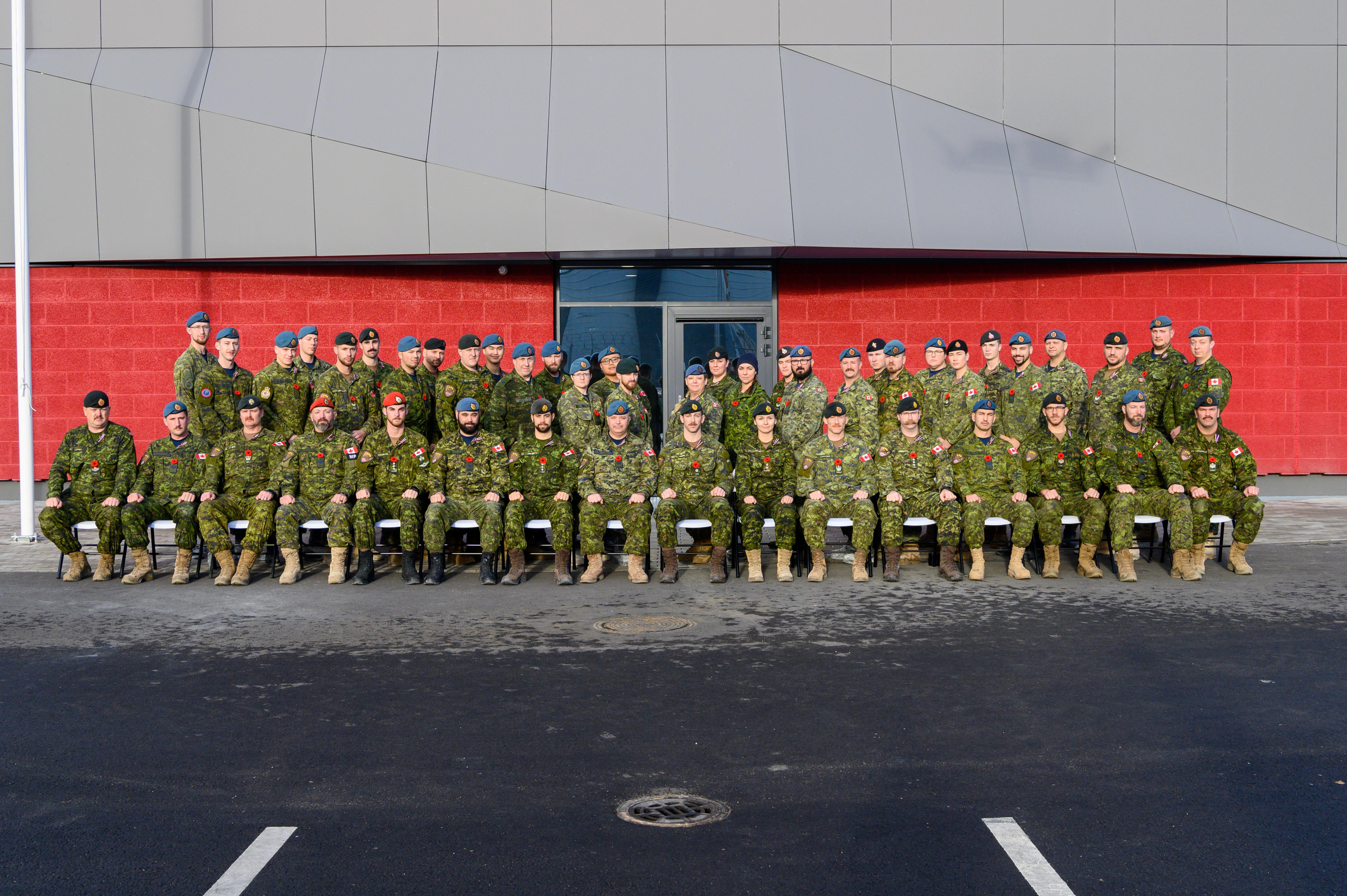 The CAF team completing MNHQ fit-up construction, November 2020. As a deployed force working in a COVID bubble in compliance with host nation policies, MNHQ members were not required to wear masks during the shooting of this picture.