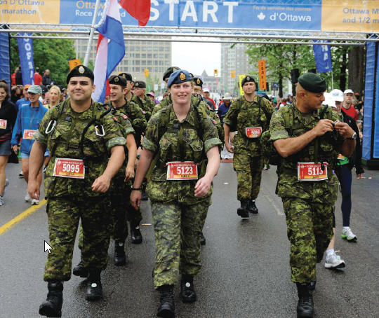 MCpl Justin Pike (left), MCpl Angela Abbey and Capt David Tischhauser, members of the Nijmegen National Capital Region Team Two, during the Ottawa Marathon, held May 29. The team did the 42 km marathon march as part of their work-up training for the upcoming Nijmegen Marches.