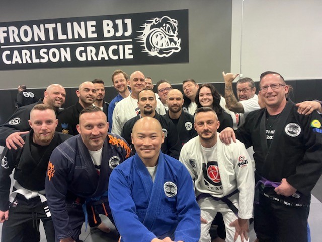 Capt Kyle Ho, RPOU(W) Program Officer (middle in blue Gi) with the Frontline Academy morning class crews with many also served in the RCMP, military, and emergency services.