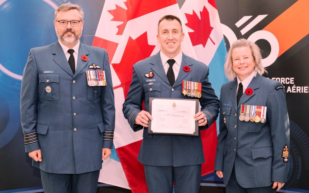 Col Daniel Coutts, 15 Wing Comd, Capt Tim Cook, OC RPOD Moose Jaw, and CWO Rachel Fox, 15 Wing CWO during the award ceremony