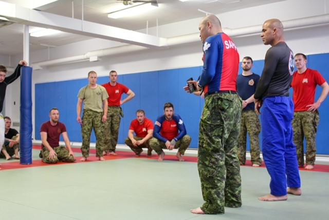 Capt Kyle Ho introduced Professor Carlos Alexandre de Carvalho Rodrigues to 1 CMBG Team.  Photo by Cpl Ilya Karassev, 1 CER Grappling Head Coach