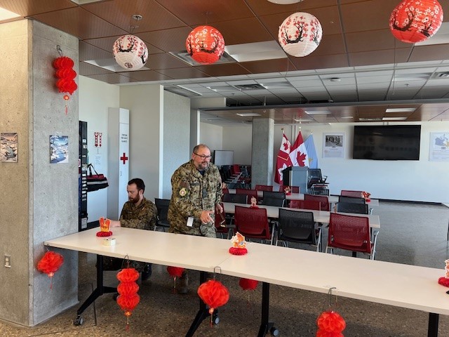 Taste of Asia - Capt Bruce Blanchard (R) and Capt Benjamin Campbell (L) prepare for the final Taste of Asia event at RPOU-W, wrapping up the 2025 celebrations.