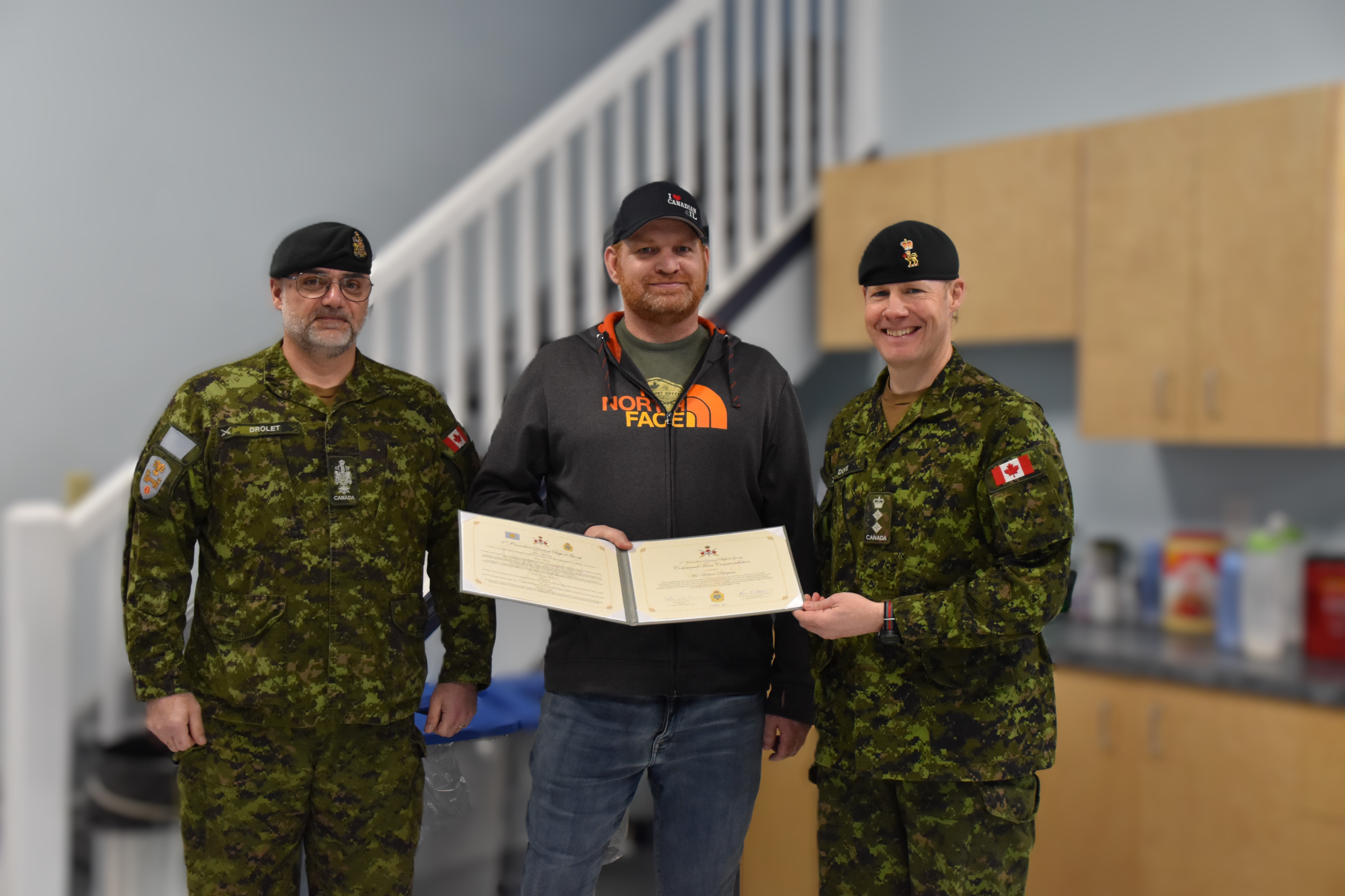3 CDSG Command Team Commendation – (L-R) 3 CDSG RSM, CWO Marc Drolet, RPOU(W) Wainwright Productions Officer, Mr. Robert Pettigrew, and 3 CDSG Comd, Col Robbin Dove