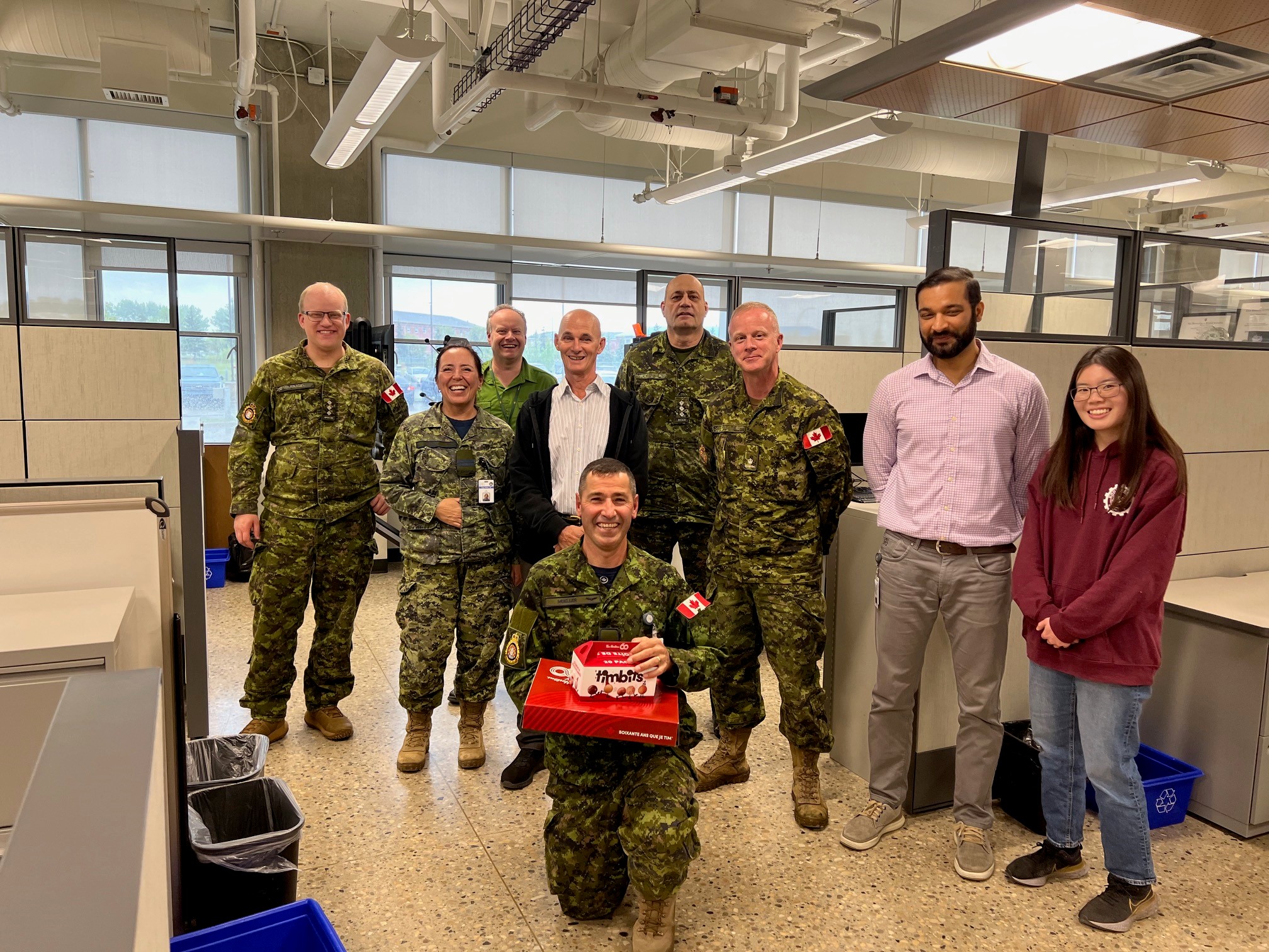 Maj Michael Mueller shared their BD joys with DCC, public servants, and military personnel in RPOU(W) HQ. Photo by Capt Kyle Ho