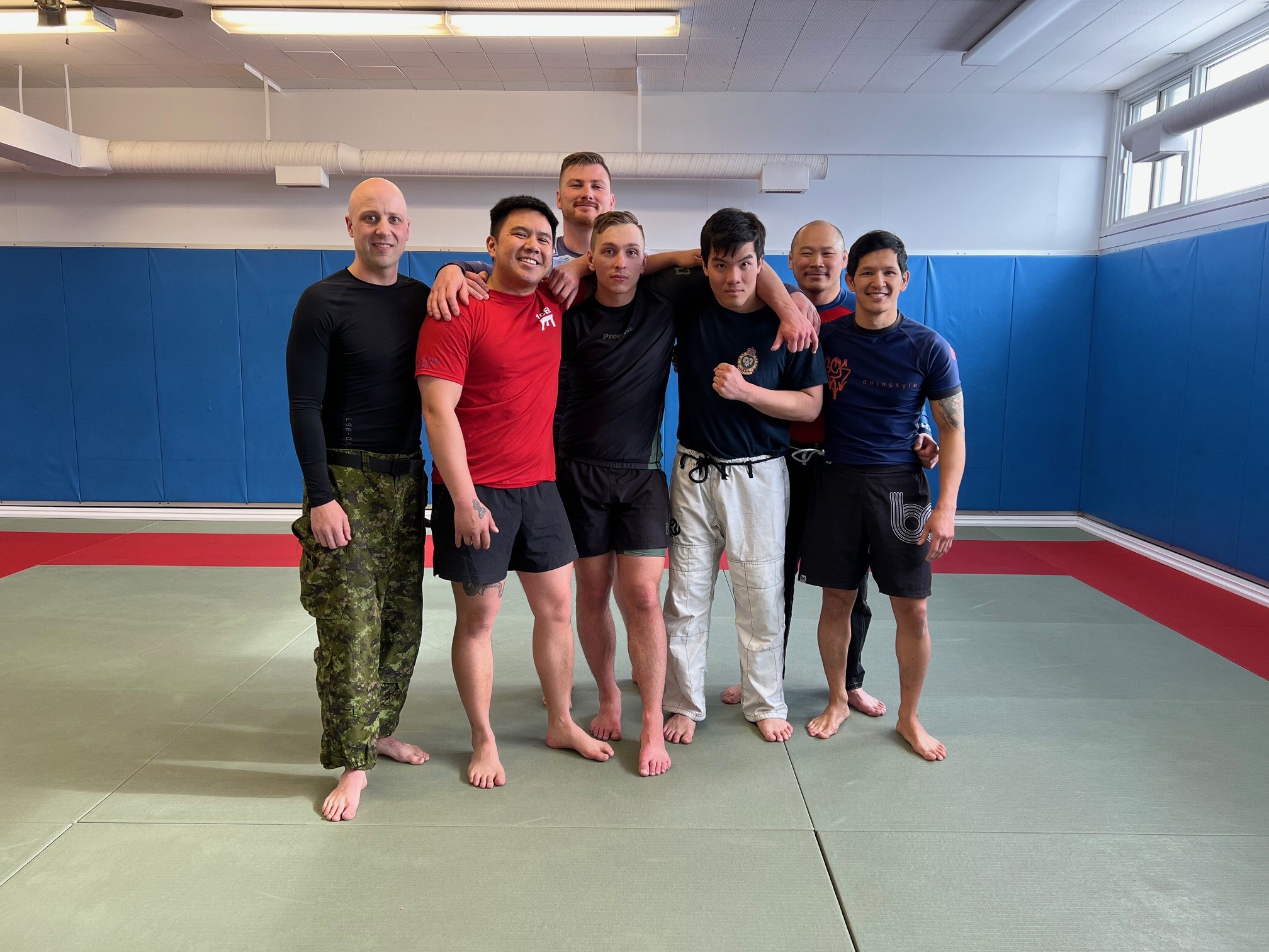  3 Cdn Div gathered to celebrate the Depart with Dignity on the mat marks the end of Cpl Karassev’s service in the military.departure gift on behalf of the CFB Edmonton Grappling Team. This gesture marks the end of Karassev's service and celebrates the enduring friendships formed on the mat.  Photo Supply  Photo 5 – 