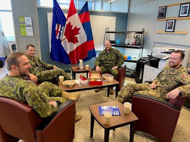 RSM BD – (L-R) RPOU-W DCO, Maj Duncan Cornish, RPOU-W CO, LCol Johnathan Hallett, RPOU-W UCWO, CWO Craig Watts, and RPOU-W Ops O, Capt Benjamin Campbell celebrating CWO Craig Watts’ birthday while discussing important business at the table.