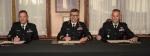 LGen Paul Wynnyk, Commander of the Canadian Army, CWO Alain Guimond, outgoing Army Sergeant Major, (Left) and CWO Stuart Hartnell, incoming Army Sergeant Major (Right) sign the Change of Appointment scroll.