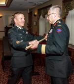 CWO Alain Guimond returns his pace stick to LGen Paul Wynnyk at the Change of Appointment Ceremony. Photo By: O/S Camden Scott, D of Army Public Affairs