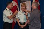 Brigadier-General Jennie Carignan (center) is promoted by Major-General Eric Tremblay (left) and her husband Eric Lefrançois at a ceremony held at Canadian Forces College in Toronto, ON./La brigadier-général Jennie Carignan (au centre) est promue par le major-général Éric Tremblay (à gauche). Son conjoint Éric Lefrançois figure également sur la photo, prise lors d’une cérémonie tenue au Collège des Forces canadiennes à Toronto (Ontario).