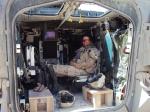 Brigadier-General Jennie Carignan, the commanding officer of Task Force Kandahar Engineer Regiment, takes a break in her Light Armoured Vehicle III in the District of Arghandab, Afghanistan in June 2010./Le Bgén Jennie Carignan, alors commandant du régiment de génie de la Force opérationnelle Kandahar, prend une pause dans son véhicule blindé léger III dans le district d’Arghandab, en Afghanistan, en juin 2010.