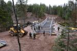Combat Engineers work on the construction of the new recreational vehicle bridge across the Tetagouche River. (5th Canadian Division/Contributed)/Des sapeurs de combat travaillent à la construction du nouveau pont pour véhicules récréatifs traversant la rivière Tetagouche. (Photo : contribution de la 5e Division du Canada)