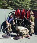 Cpl Elliot, PH Tech with Cpl Sohn and Cpl Wiper, Const Tech, finalizing the water guns station of the VWR // Cpl Elliot, Tech PC avec Cpl Sohn and Cpl Wiper, Tech Const, finalisant la station des pistolets à haute pression