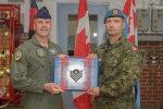Brigadier General (USAF) Chad Manske promotes Sgt Nelson Nordstrom