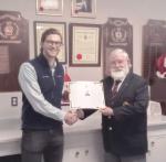 Andrew Jarvis receives the CMEA Memorial Bursary from John MacPherson, CMEA Registrar in Chilliwack BC