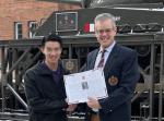 Benson Du accepts 2022 CMEA Bursary from Col Eppo van Weelderen (Ret'd).jpg