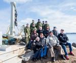 Front row from left, Elspie and Charles Caterer, Brian Lapierre, Jim Mosley. Middle row from left, Patti Christie, Dinger Bell, Valerie Griffin and Dick Tilley. Back row from left, CAF members from 144 and 143 CEF – Corporal (Cpl) Rob White, Captain Marc Lukaszczyk-Therien, Sgt Joe Wynands, Avr Travis Decker, Cpl Clarence Parnell, and Avr Joshua McKay. Photo: Mona Ghiz, MARLANT PA