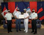 LCol Krajcik, CO 1 ESU, accepts the Canadian Forces' Unit Commendation from VAdm Auchterlonie, Comd CJOC, on behalf of 1 ESU members for work done on the Task Force Latvia Multinational Headquarters build project, 22 July 2021. // Le Lcol Krajcik, Commandant de la 1er UAG, accepte la mention élogieuse à l’intention des unités des Forces canadiennes // Le Lcol Krajcik, Commandant de la 1er UAG, accepte la mention élogieuse à l’intention des unités des Forces canadiennes