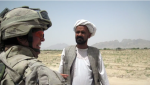 Lt.-Col. Jennie Carignan speaks to area resident Yar Mohammad about a retaining wall project near his village along the Tarnak River in the Dand Distrct of Kandahar province in August, 2010. Carignan, now a brigadier general, has been assigned command of the NATO training mission in Iraq. (Dene Moore/The Canadian Press)