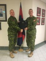 Official handover from the outgoing RCE SM, CWO Croucher (Left) to the incoming RCE SM, CWO Dominic Gaudreau. Of particular note is the awesome circa 1987 Cbt Engr, old school, field cap hat badge that is permanently affixed to the “Succession Planning Binder.” Photo Credit: MCpl Marc Laliberte.
