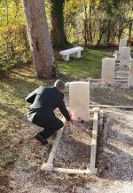 Laying a poppy on one of 29 Canadian graves in the Supt Cemetery.