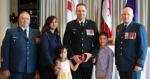 Outgoing Commanding Officer of RPOU(P), Lieutenant-Colonel David Burbridge, with his family after being presented his Canadian Decoraction Bar.