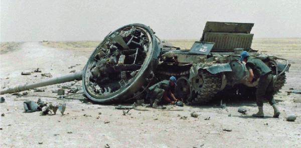 Sappers examine Iraqi tank in Kuwait