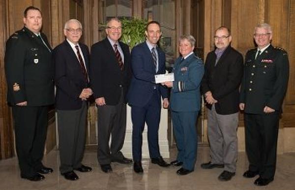Mr. Eric Marion of TD presents a $21,245 cheque to LGen Christine Whitecross
