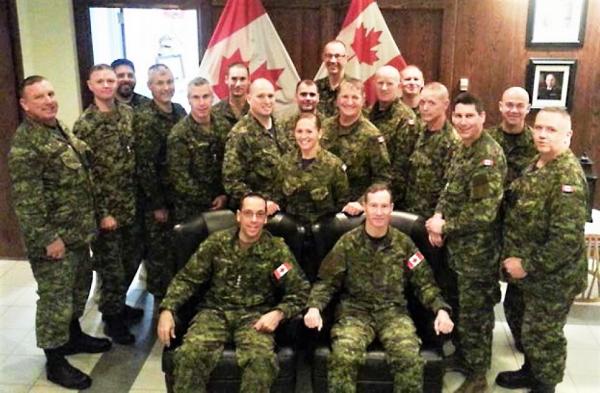 Colonel Martin Gros-Jean, Comd CF RP Ops Gp (seated, left) and Chief Warrant Officer Gord Aitken, FCWO (seated, right) surrounded by the Regional command teams and CF HQ staff.