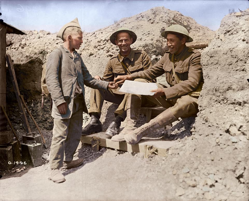 Tom Longboat buying a newspaper from a French newsboy in 1917.